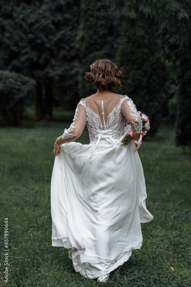Beautiful wedding bride and groom at wedding day outdoors at ocean beach. Happy marriage couple o Beautiful wedding bride and groom at wedding day outdoors at ocean beach. Happy marriage couple o