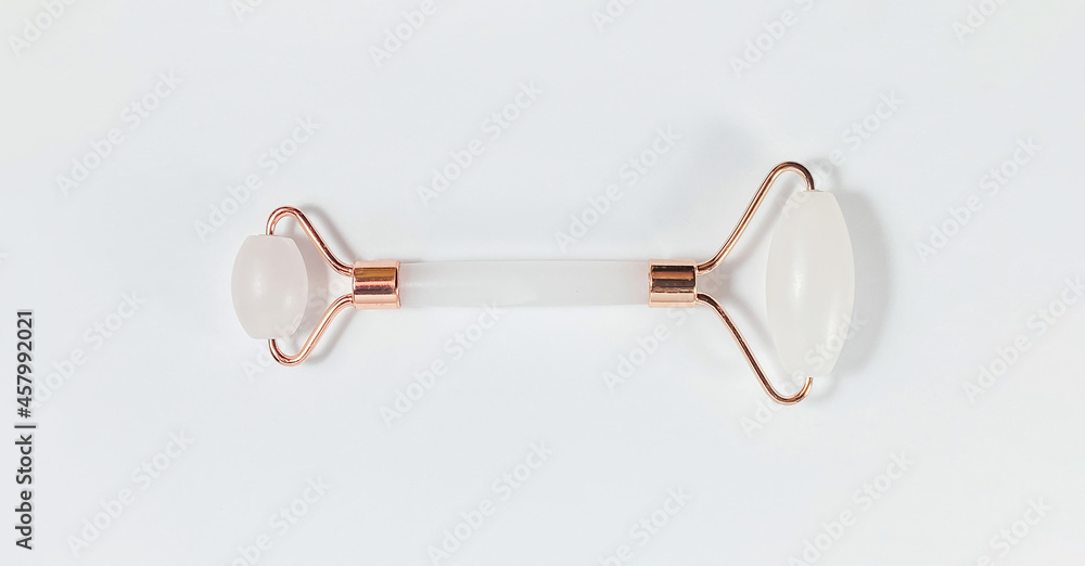 White massage quartz roller for the face close-up isolated on a white background