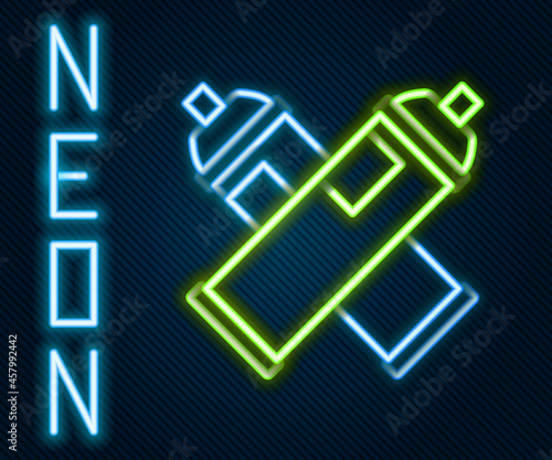 Glowing neon line Paint spray can icon isolated on black background. Colorful outline concept. Vector