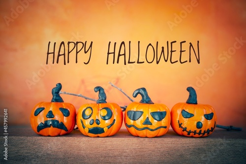 Happy Halloween greeting card idea, Funny Halloween pumpkin collections over blurred orange background, Halloween decoration item