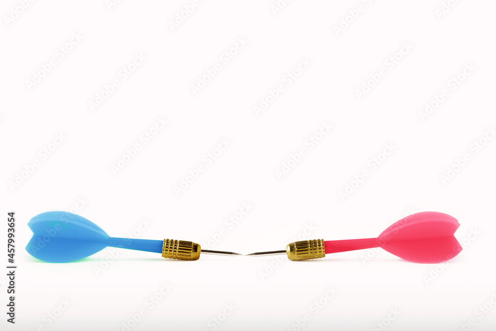 Blue dart against pink dart on white background - Concept of gender struggles Blue dart against pink dart on white background - Concept of gender struggles