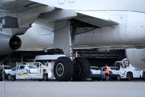 Close-up of front wheels and landing gear of airplane at Zurich Airport on a late summer evening. Photo taken September 9th, 2021, Zurich, Switzerland.