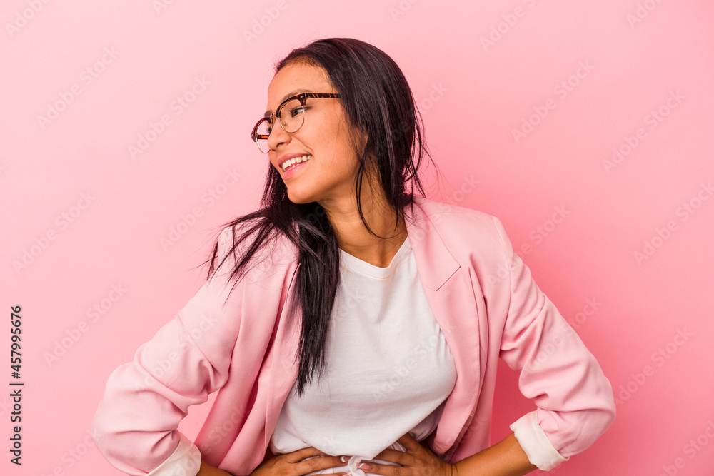 Young latin woman isolated on pink background confident keeping hands on hips. Young latin woman isolated on pink background confident keeping hands on hips.