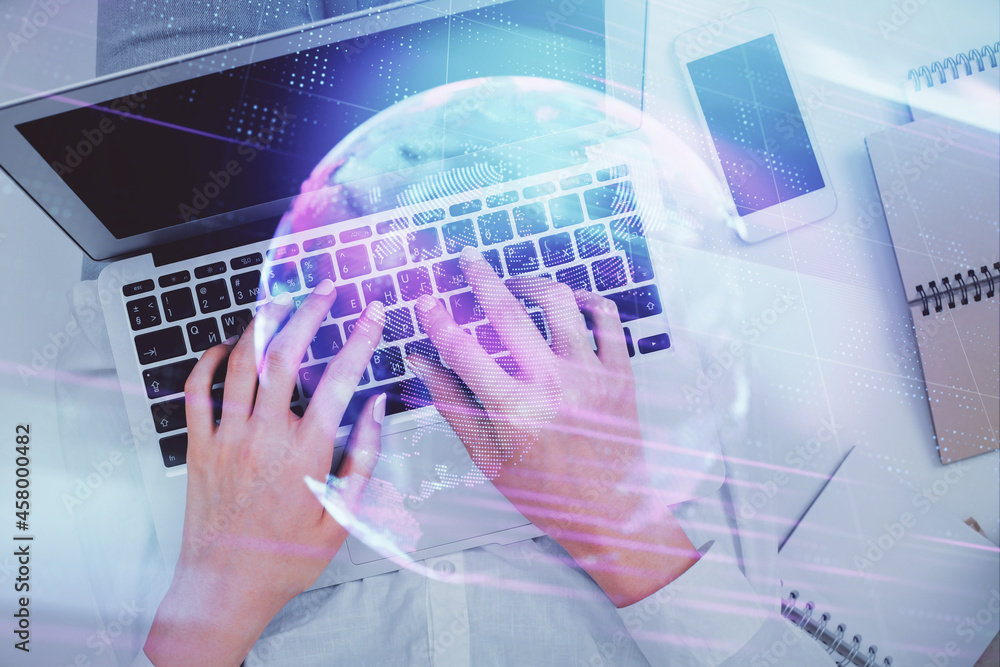 Double exposure of woman hands working on computer and tech theme hologram drawing. Top View. Technology concept. Double exposure of woman hands working on computer and tech theme hologram drawing. Top View. Technology concept.