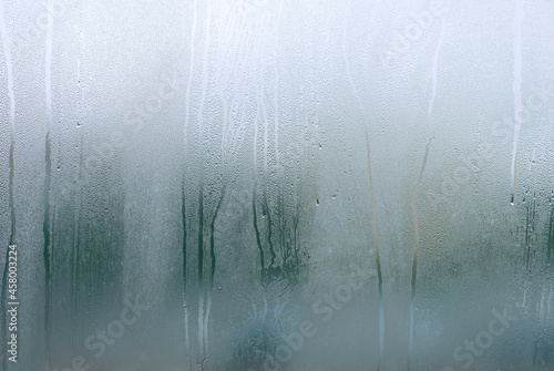 Window with condensate or steam after heavy rain, large texture or background.