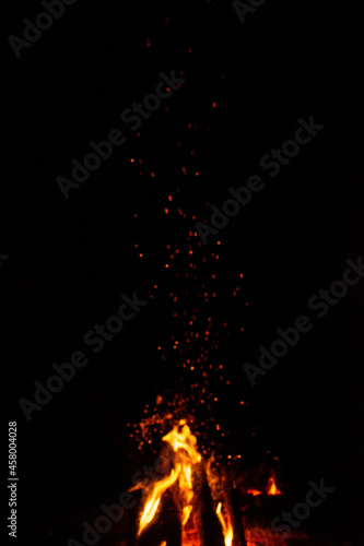 flame of fire with sparks on a black background