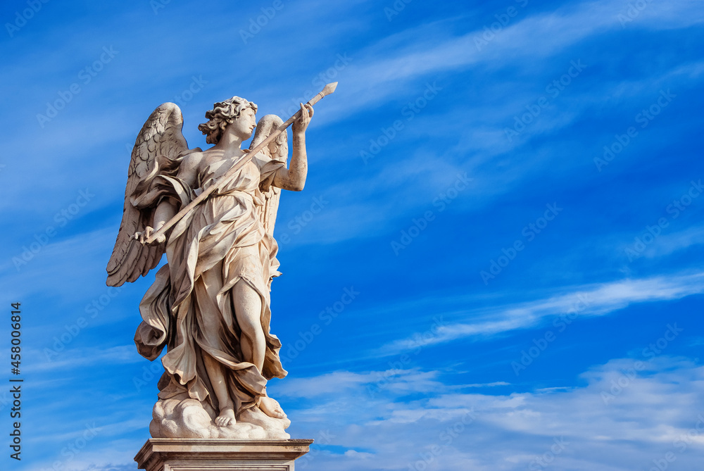 Angel holding the Holy Lance of Longinus with beautiful sky. A 17th century baroque masterpiece at the top of Sant'Angelo Bridge in the center of Rome