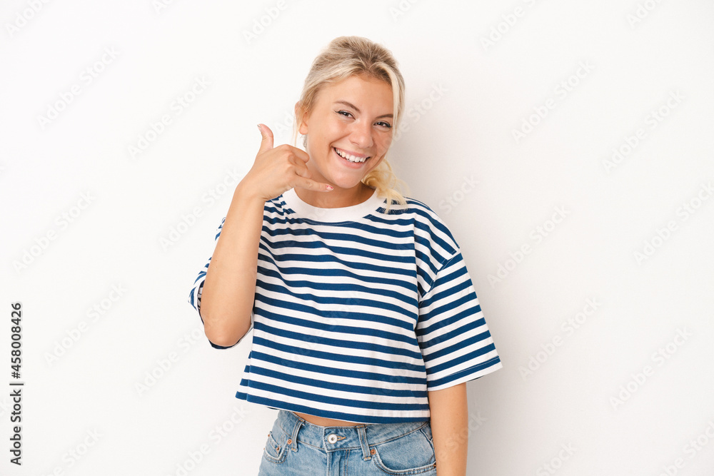 Young Russian woman isolated on white background showing a mobile phone call gesture with fingers. Young Russian woman isolated on white background showing a mobile phone call gesture with fingers.