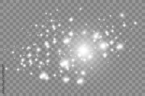 Vector sparkles on a transparent background. Christmas abstract pattern. Sparkling magical dust particles.