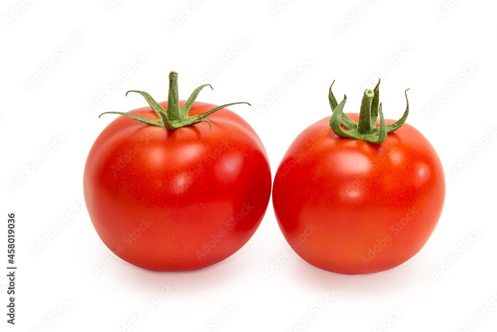 Two ripe red tomatoes on a white background Two ripe red tomatoes on a white background