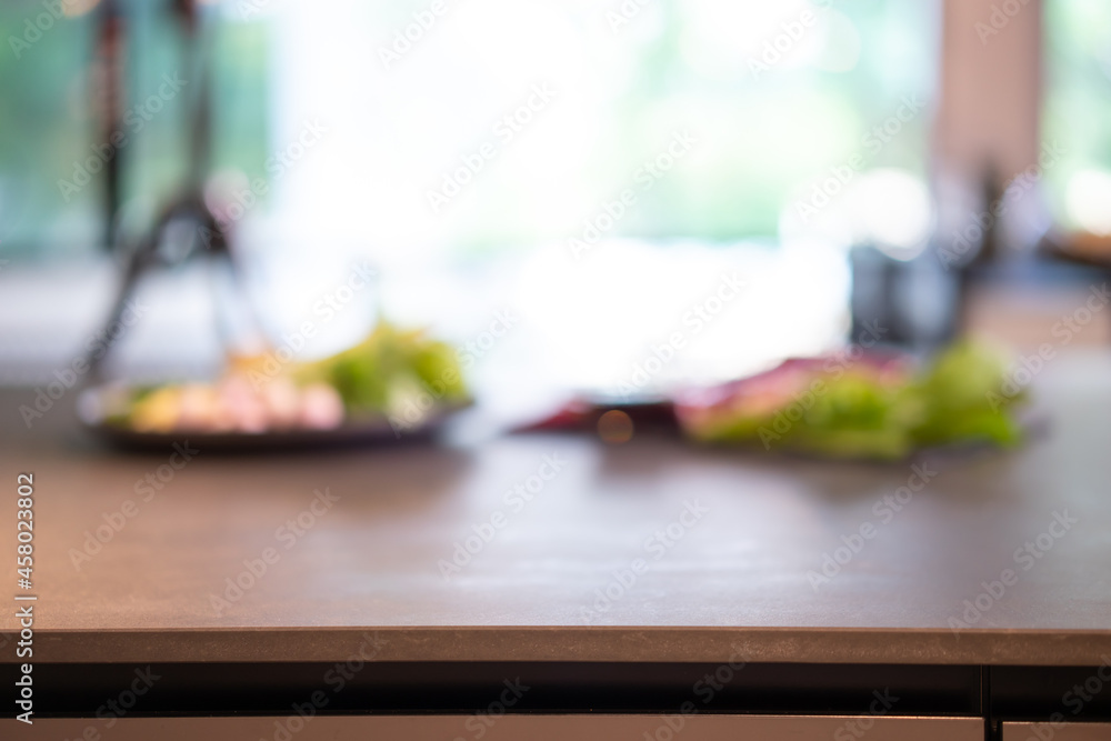 Stone granite Counter table in the kitchen with blur raw ingredient food background for a food product backdrop. Stone granite Counter table in the kitchen with blur raw ingredient food background for a food product backdrop.