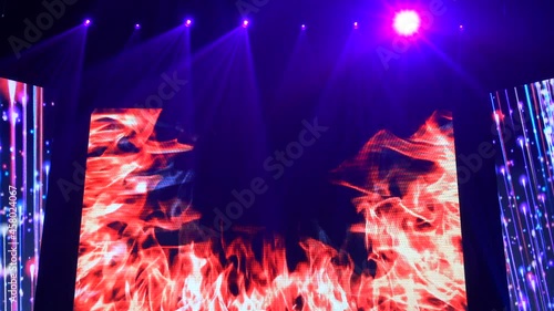 Animation of stage lights frame. Bright shiny stage lights flashing movement entertainment spotlight projectors in the dark, blue soft light spotlight strike on black background.