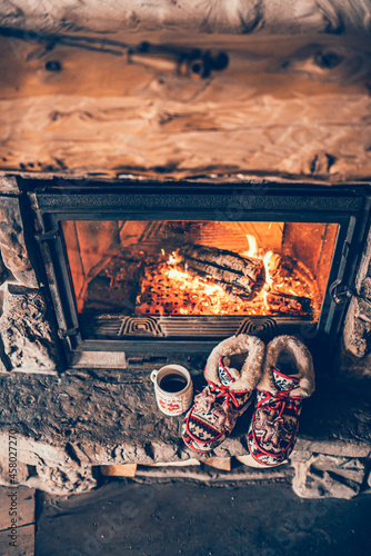 Wall Mural Christmas comfortable slippers by the warm cozy fireplace