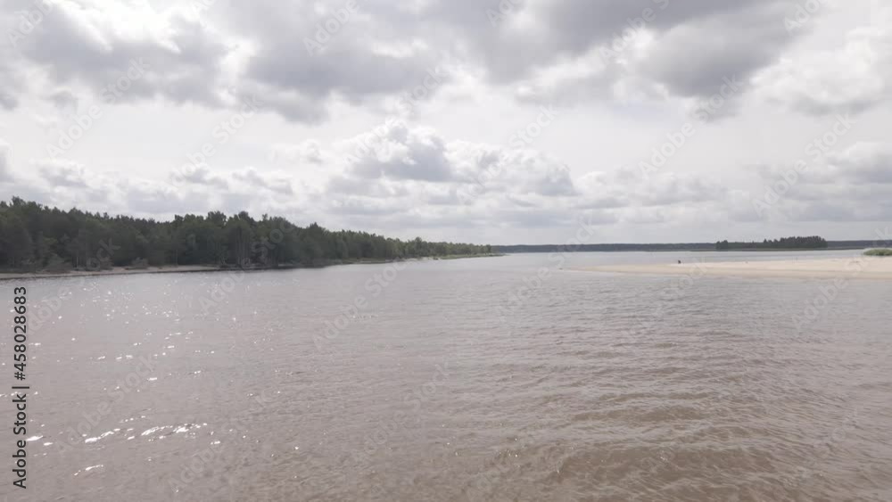 Drone flying over a river delta near sea, birds flying around Drone flying over a river delta near sea, birds flying around