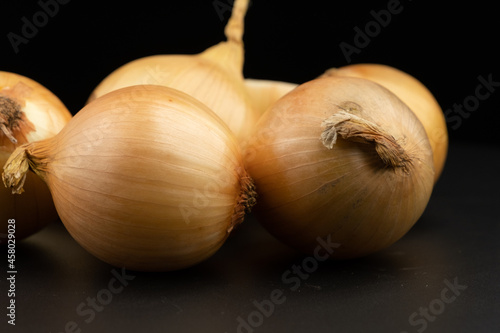 Whole group pile ingredient of fresh onion  group isolated on black background