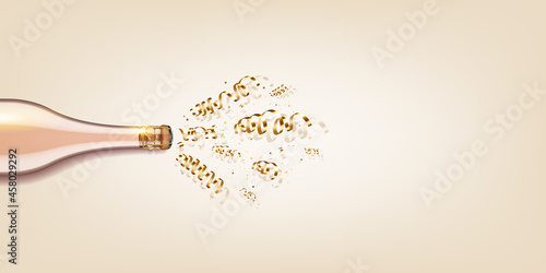 Bottle of champagne with ribbons and confetti.