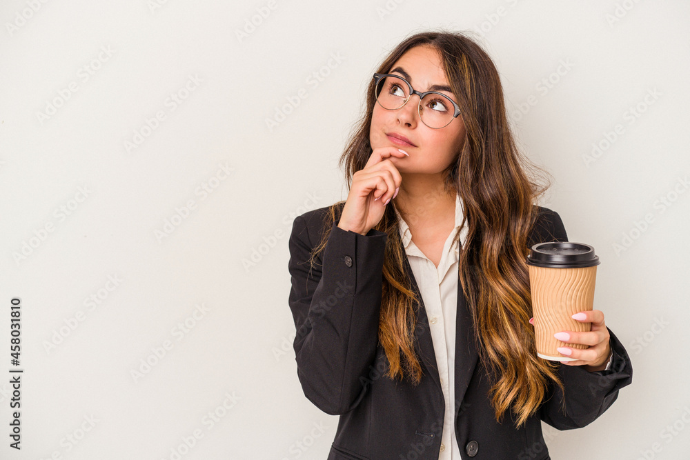 Young caucasian business woman holding a takeaway coffee isolated on white background looking sideways with doubtful and skeptical expression. Young caucasian business woman holding a takeaway coffee isolated on white background looking sideways with doubtful and skeptical expression.