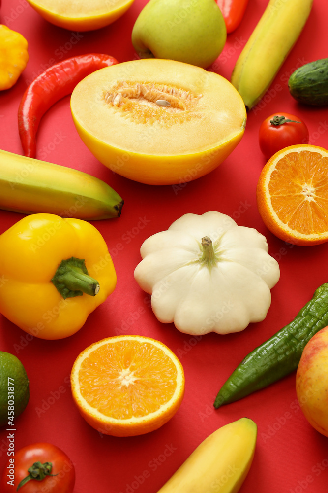 Set of different vegetables and fruits on red background Set of different vegetables and fruits on red background