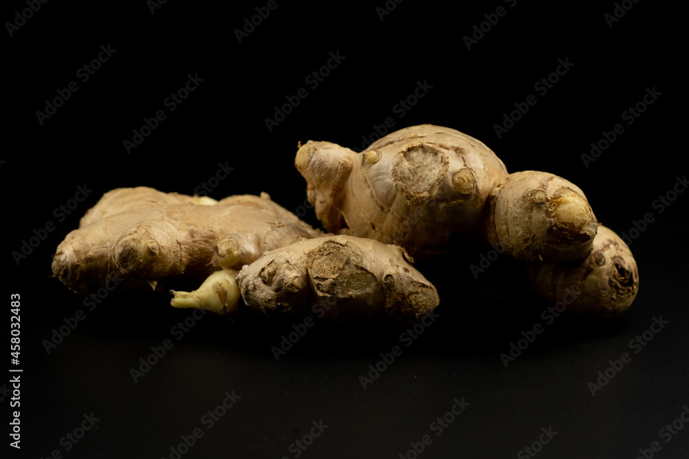 Whole group pile ingredient of fresh ginger group isolated on black background Whole group pile ingredient of fresh ginger group isolated on black background