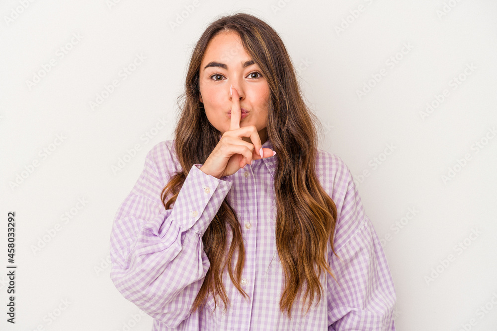 Young caucasian woman isolated on white background keeping a secret or asking for silence. Young caucasian woman isolated on white background keeping a secret or asking for silence.