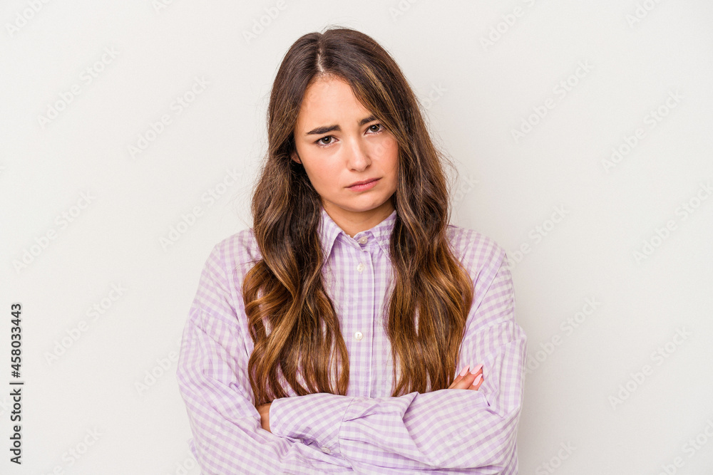 Obraz premium Young caucasian woman isolated on white background unhappy looking in camera with sarcastic expression.