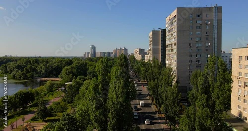 Soviet buildings with trees and cars from drone photo