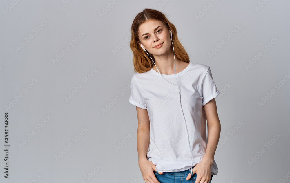 Woman in white t-shirt music entertainment light background Woman in white t-shirt music entertainment light background