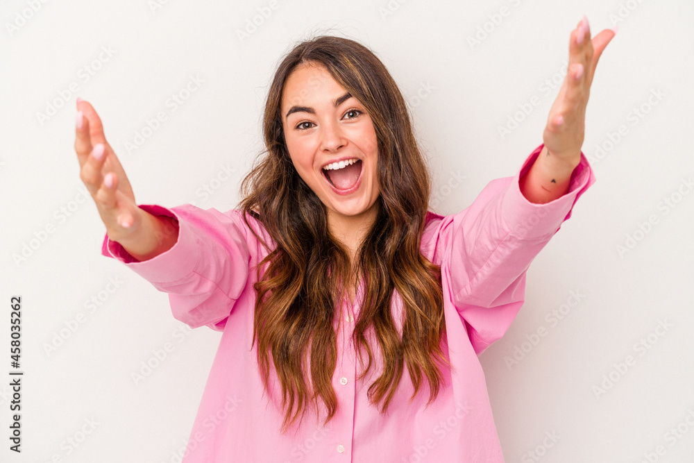 Young caucasian woman isolated on white background celebrating a victory or success, he is surprised and shocked. Young caucasian woman isolated on white background celebrating a victory or success, he is surprised and shocked.