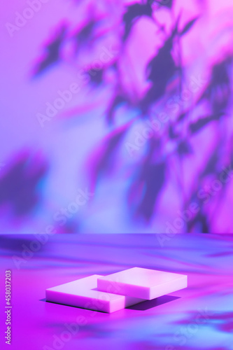 Abstract surreal scene - empty stage with two rectangle white podiums lying on pastel neon holographic colored background. Pedestal for cosmetic product packaging mockups display presentation