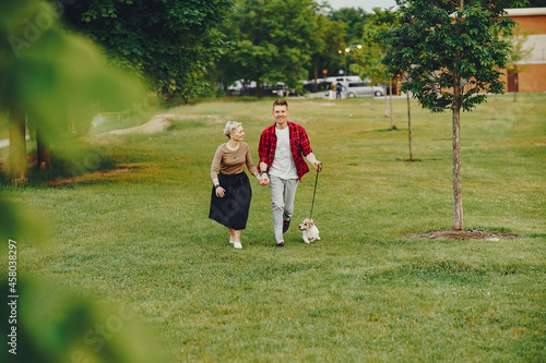 happy couple with dog in Chicago park