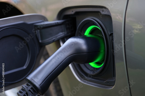 Electric car and charging at charging station closeup