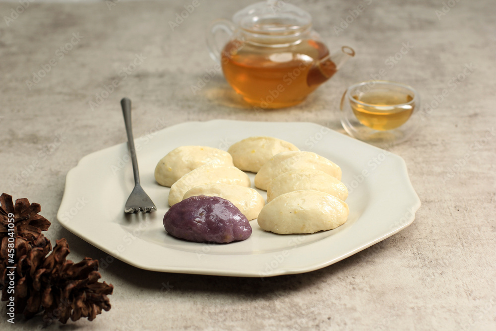 Songpyeon, Traditional Chuseok Day Food, Korean Half Moon Shaped Rice Cake.  Made from Korean Rice Flour with Sesame Seed or Chopped Nuts, Honey, or Red Bean Paste