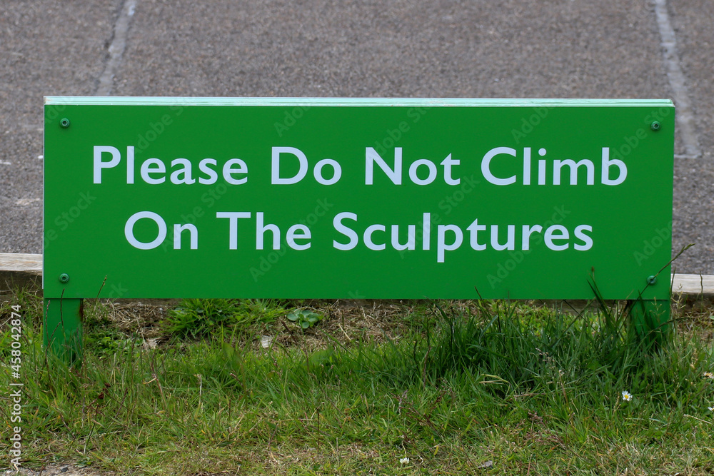 Do Not Climb On The Sculptures sign at a Tourist Car Park