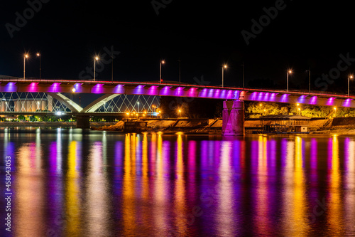 Novi Sad  Serbia August 24  2021  Rainbow bridge  Novi Sad  Serbia. Night reflection in Novi Sad
