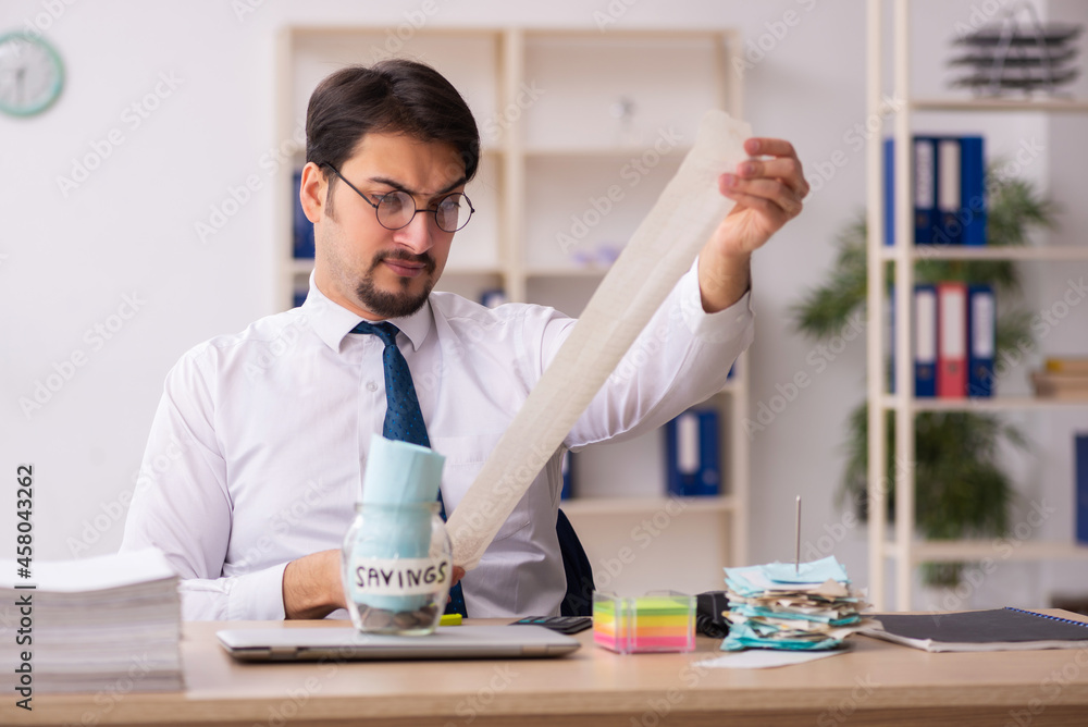 Young male bookkeeper in pension concept Young male bookkeeper in pension concept