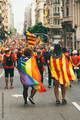 girls with flag LGBT and Catalunya flag