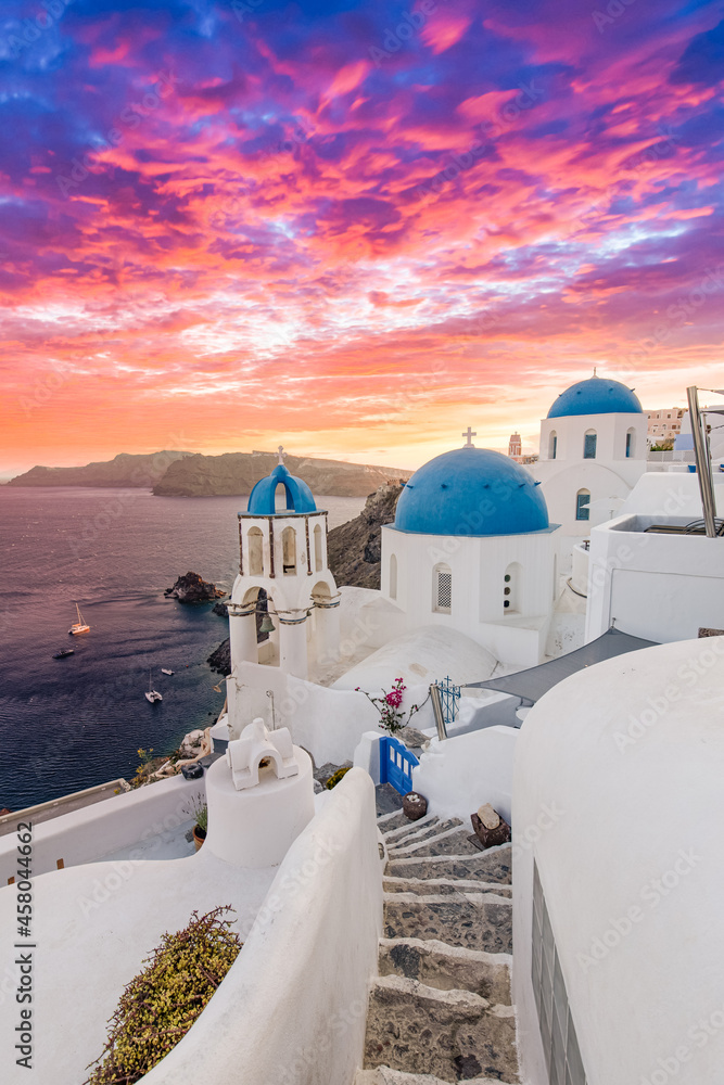 Naklejka premium Europe summer destination. Traveling concept, sunset scenic famous landscape of Santorini island, Oia, Greece. Caldera view, colorful clouds, dream cityscape. Vacation panorama, amazing outdoor scene