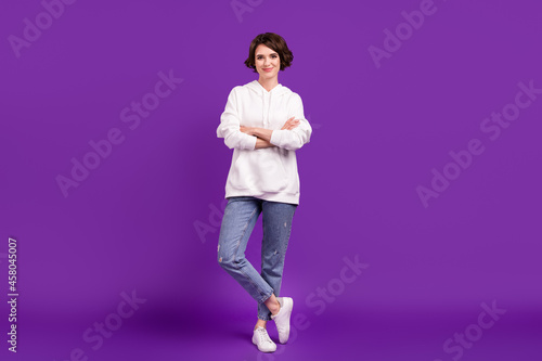 Full length body size photo girl smiling in casual clothes crossed hands isolated vivid purple color background