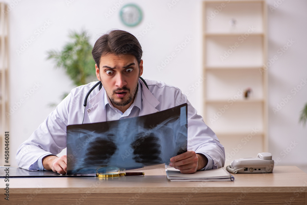 Young male doctor radiologist working in the clinic Young male doctor radiologist working in the clinic