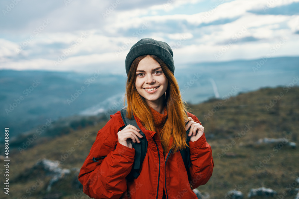 cheerful woman hiker walking in the mountains active vacation travel