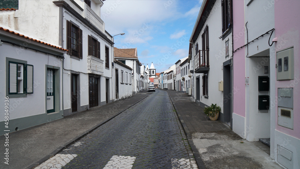 deserted cobblestone road in the old town with traditional houses, Horta, Azores