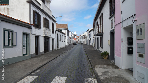 deserted cobblestone road in the old town with traditional houses  Horta  Azores