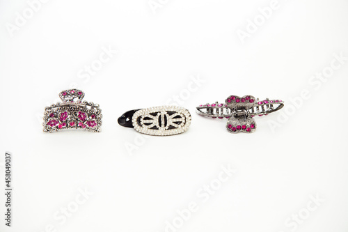 Hair clips.sets with stones. metal. three hair clips. on a white isolated background.
