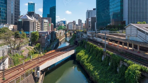 [4K Timelapse] Wide angle movie of Multiple trains passing by near Hijiri-bashi bridge at Tokyo, Japan. photo