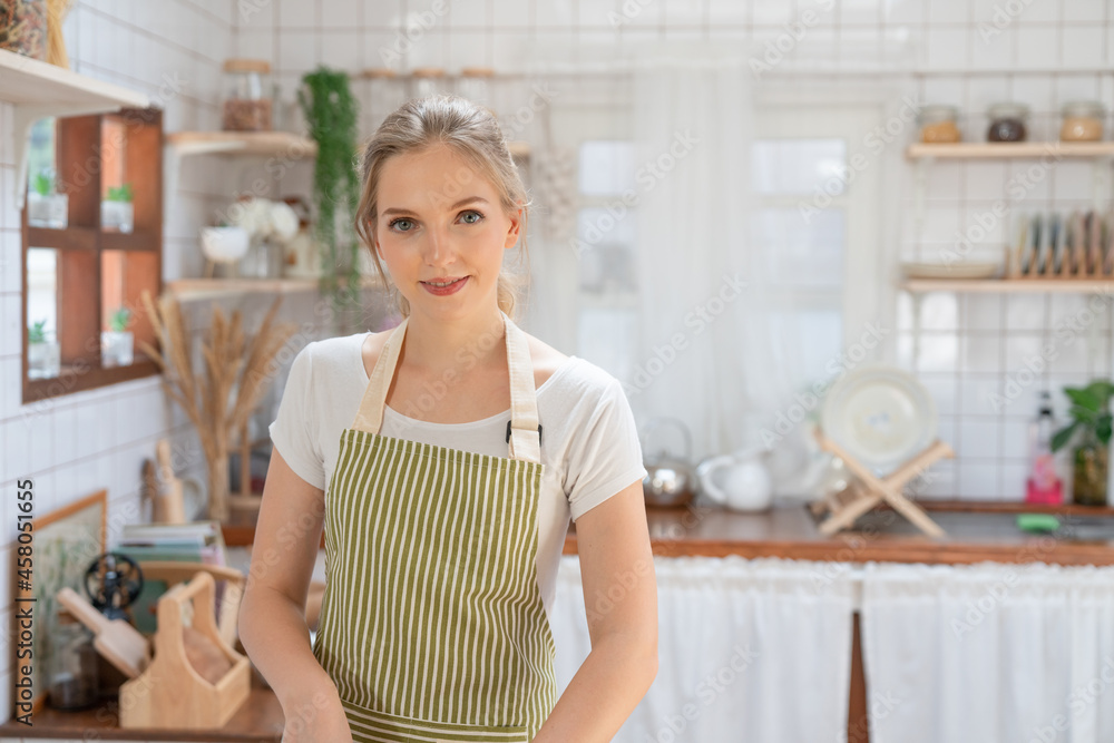 Portrait of beautiful young woman making healthy food in kitchen room at home. Portrait of beautiful young woman making healthy food in kitchen room at home.