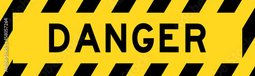 Yellow and black color with line striped label banner with word danger