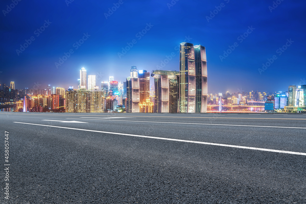 Panoramic skyline and empty asphalt road with modern buildings