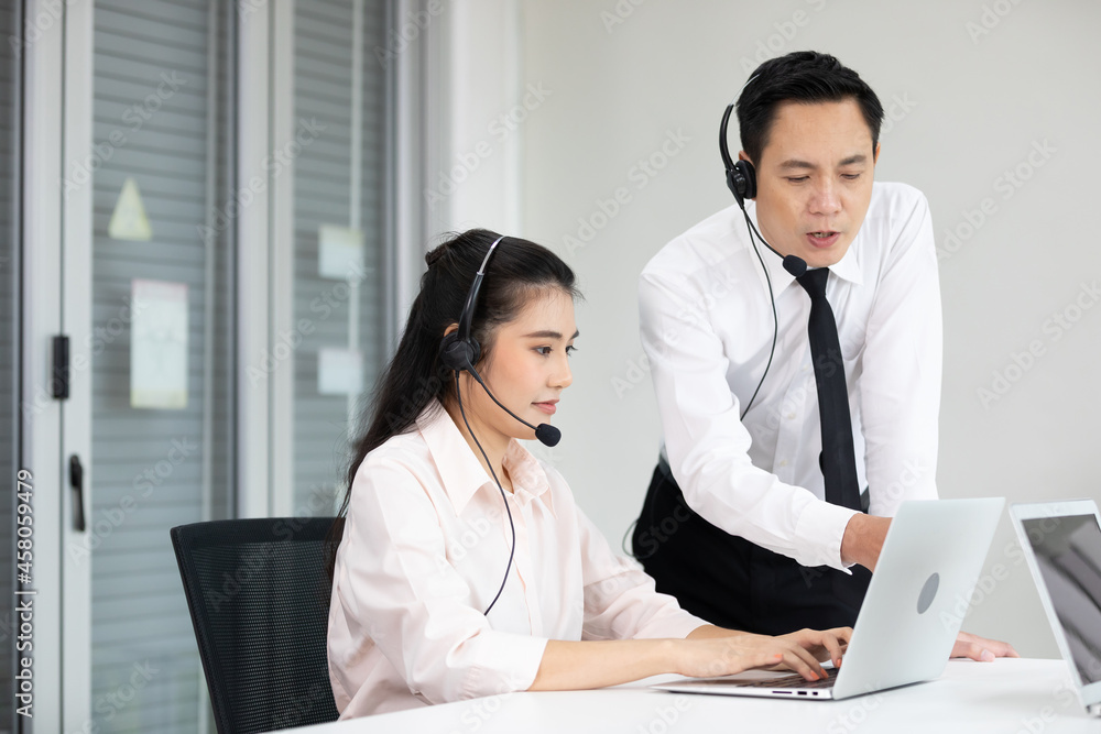 businessman supervisor training and suggesting about work to colleagues at call center service businessman supervisor training and suggesting about work to colleagues at call center service