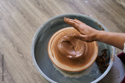 making ceramic pottery on a potter's wheel
