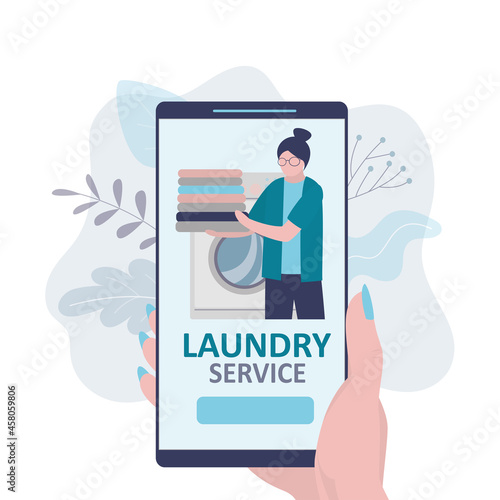 Woman orders of dry cleaning service by smartphone. Online laundry service on phone screen.